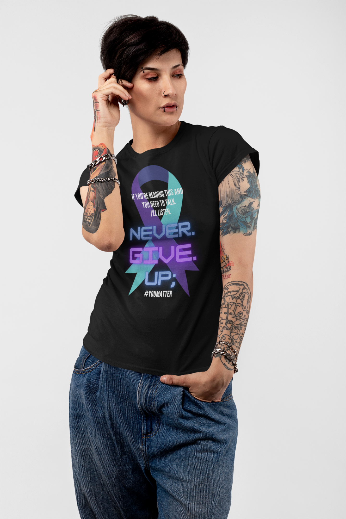 tattooed female model, wearing the black colored Never Give Up short sleeved shirt