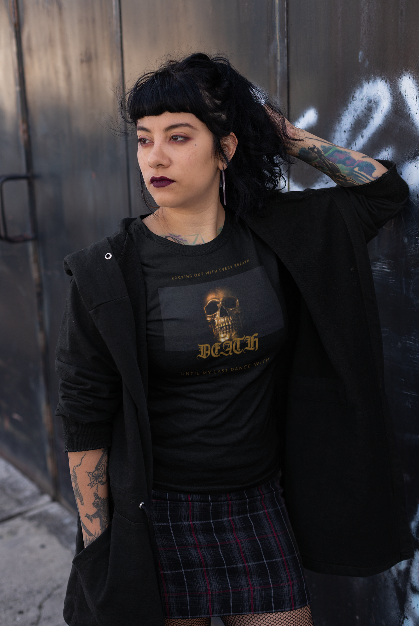 tattooed female model, wearing the Black colored Rocking Out With Every Breath Until My Last Dance With Death short-sleeved shirt